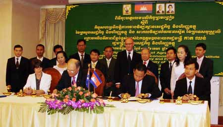 The Deputy Prime Minister of Cambodia, His Excellency Keat Chhon (third from left in front row) and CSU Chancellor Mr Lawrence Willett sign an agreement between CSU and the Economics and Finance Institute in Cambodia on Tuesday 12 April 2011.