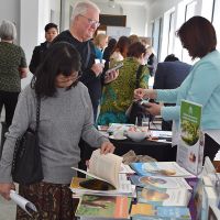 Attendees persuse the books at the Little Lost Bookshop stall. Photograph by Sarah Stitt