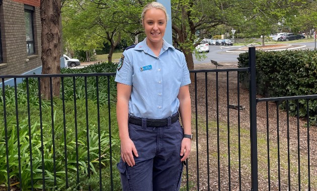 Graduate flying flag for inclusivity in NSW Police Force 
