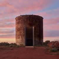 A view of the chapel from outside at sunset.