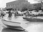 From Lennon Collection, Charles Sturt University Regional Archives. Copyright held by The Daily Advertiser, Wagga Wagga. Floodwaters in Forsyth Street near the intersection with Baylis Street, Wagga Wagga, in the 1950s. At that time, before the levee banks were built, floodwaters entered the city&rsquo;s main street area and some business owners and employees were forced to row the last block or so to work.