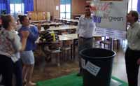 Students (far left) do their bit for recycling in the Dining Hall. They are encouraged by CSU Green Manager Mr William Adlong (far right).