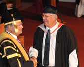 CSU television production lecturer and graduate Mr Bruce Gater shares a joke with the Chancellor Mr Lawrence Willett, AO. 