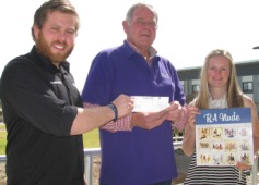 Photo of CSU student Mr Angus Stead and Ms Victoria Blake presenting the cheque to Mr Mac Armytage from Riverina Bluebell