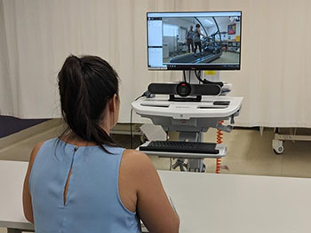 A medical practitioner overseeing a telehealth video conference