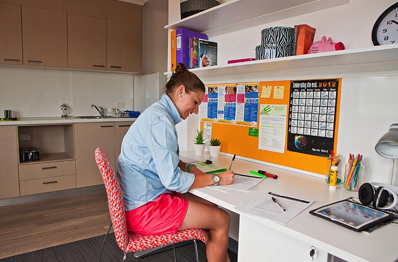 Student at her desk in her room