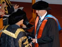 Associate Professor Gavin Ash receives his research award from CSU Vice-Chancellor Professor Ian Goulter.