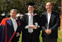 Mr Aidan Luke with his University Medal on Thursday 2 April. He was joined by his former lecturer Dr Graeme McLean (left) and father Rodney Luke. 